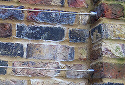 Cable Railing shown mounted to masonry brick wall surface